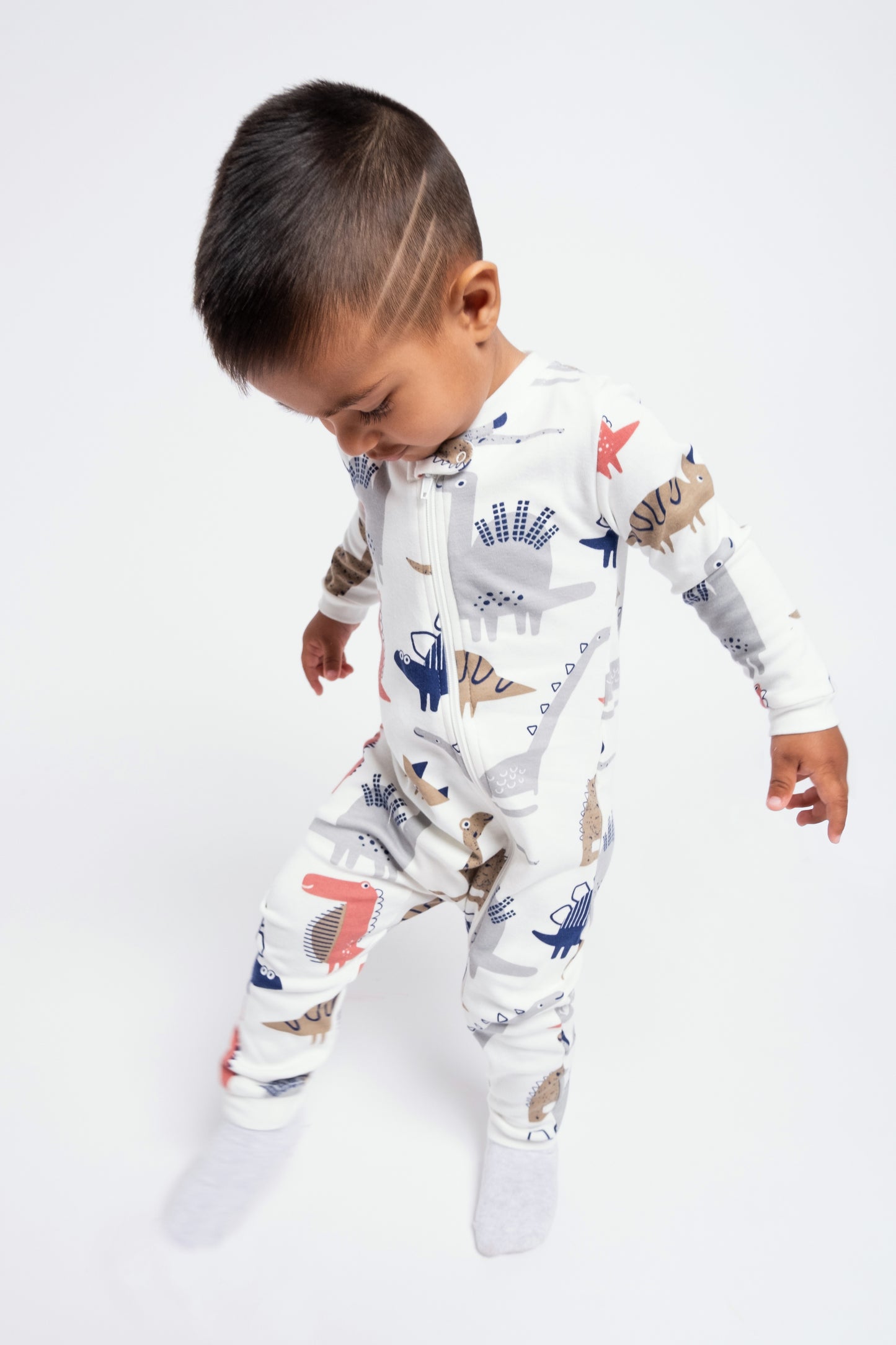 On-the-Go Zipper Jumpsuit with Non-Slip Footies in (Dino Party) Pattern - White