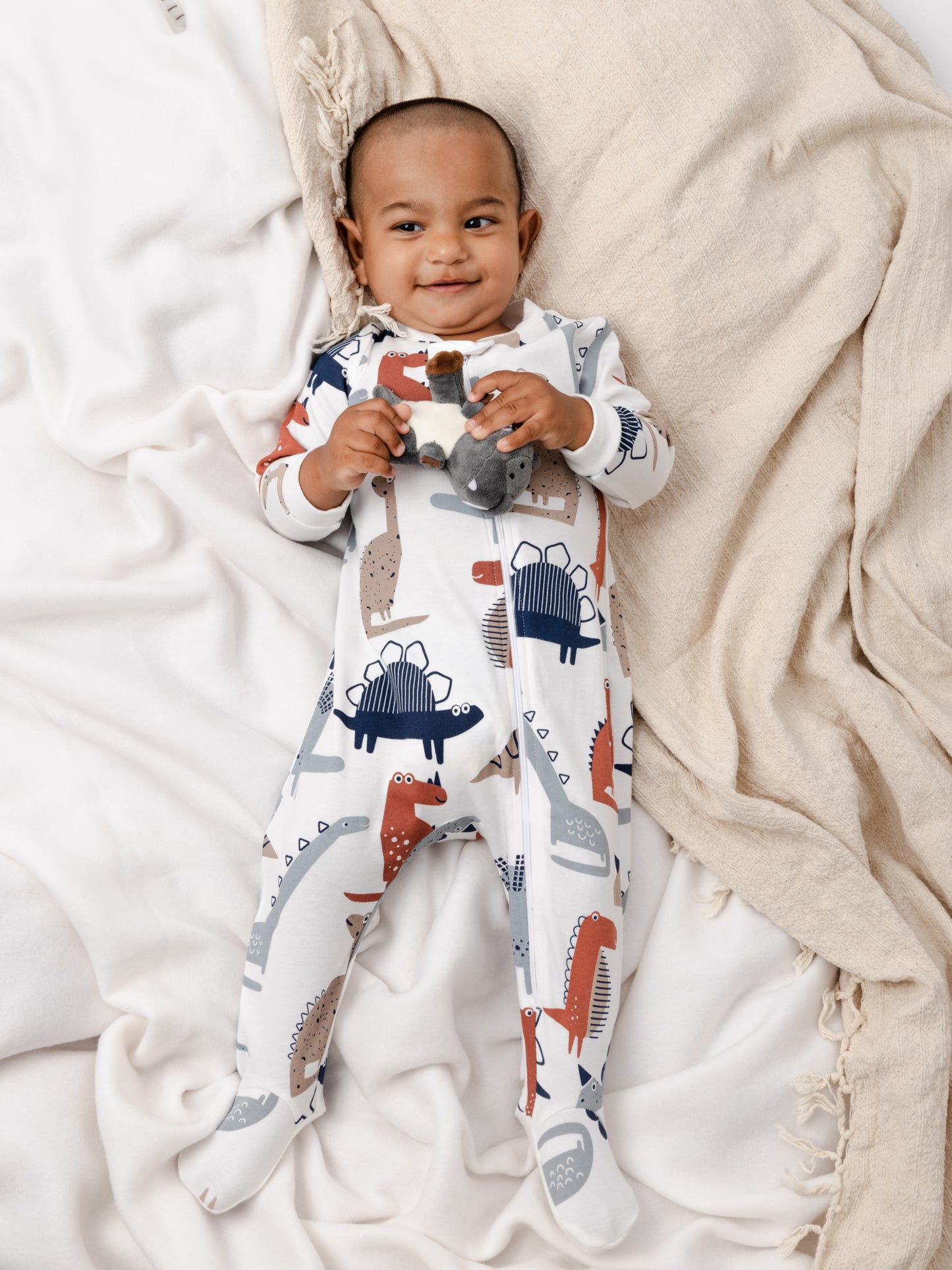 On-the-Go Zipper Jumpsuit with Non-Slip Footies in (Dino Party) Pattern - White